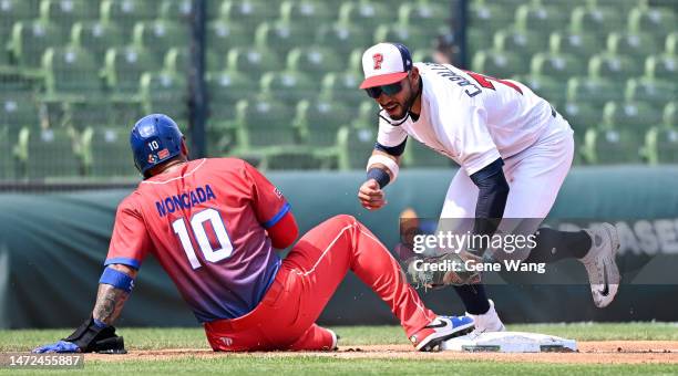 Jose Caballero of Team Panama attempt to tag out Yoán Moncada of Team Cuba at the top of the 3rd inning during the World Baseball Classic Pool A game...