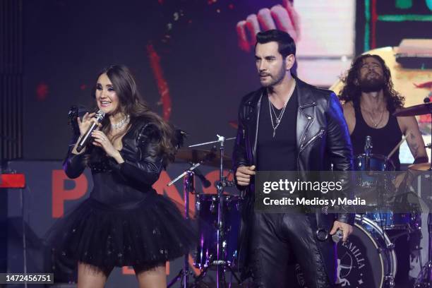 Dulce María and David Zepeda performs on stage during the presentation of the soap opera 'Pensando En Ti' at Centro Cultural Roberto Cantoral on...