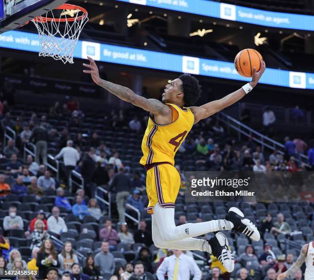 Desmond Cambridge Jr. #4 of the Arizona State Sun Devils goes up for a dunk against the USC Trojans in the second half of a quarterfinal game of the...