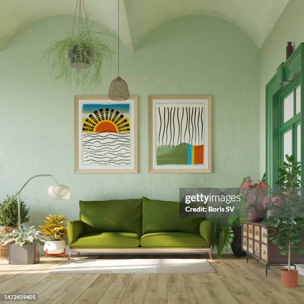 stylish living room with green sofa and posters - living room stock pictures, royalty-free photos & images