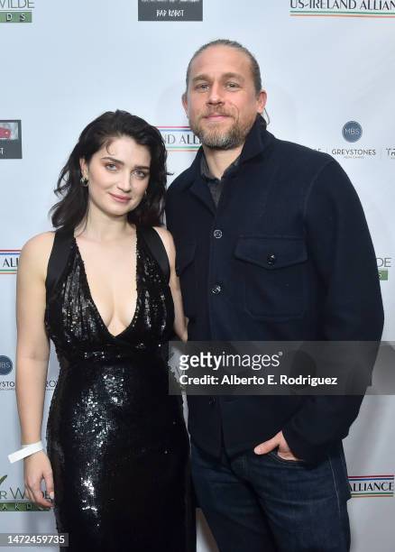 Eve Hewson and Charlie Hunnam attend Oscar Wilde Awards 2023 at Bad Robot on March 09, 2023 in Santa Monica, California.