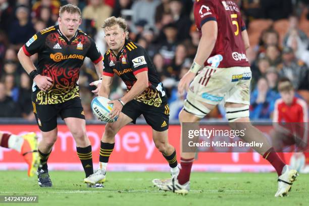 Damian McKenzie of the Chiefs looks for a gap in the defence during the round three Super Rugby Pacific match between Chiefs and Highlanders at FMG...