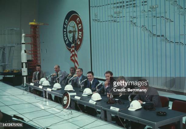 Members of the Apollo and Soyuz crews hold a press conference at the Kennedy Space Center in Cape Canaveral, Florida, on February 10th, 1975. Left to...