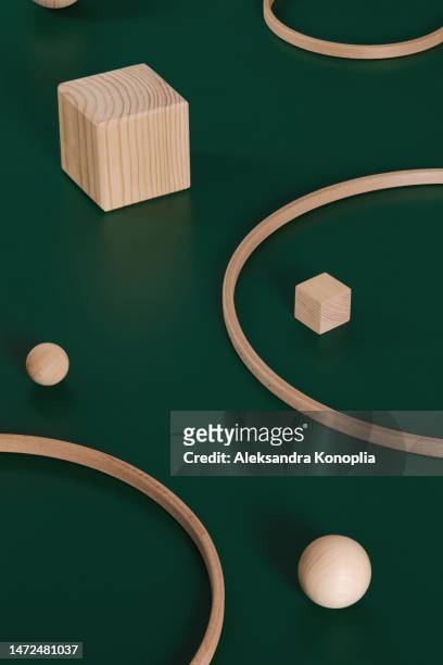 abstract minimal 3d scene showcase with natural wooden block podiums on deep dark green background. - beauty cosmetic luxury studio background stock pictures, royalty-free photos & images