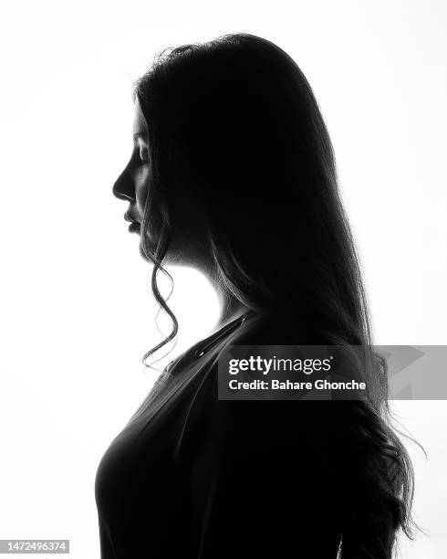 a young lady with a long hair - arab woman silhouette stock pictures, royalty-free photos & images