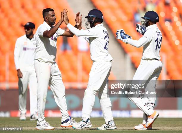 Ravichandran Ashwin of India celebrates taking the wicket of Todd Murphy of Australia during day two of the Fourth Test match in the series between...