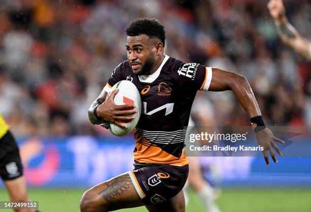 Ezra Mam of the Broncos breaks away from the defence during the round 2 NRL match between the Brisbane Broncos and the North Queensland Cowboys at...