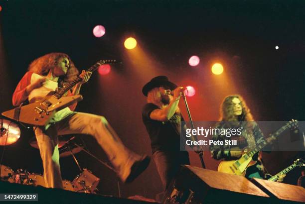 Allen Collins, Ronnie Van Zant and Gary Rossington of American rock band Lynyrd Skynyrd perform on stage at the Apollo Theatre on February 9th, 1977...