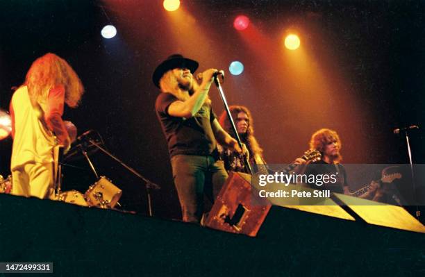 Allen Collins, Ronnie Van Zant, Gary Rossington and Steve Gaines of American rock band Lynyrd Skynyrd perform on stage at the Apollo Theatre on...