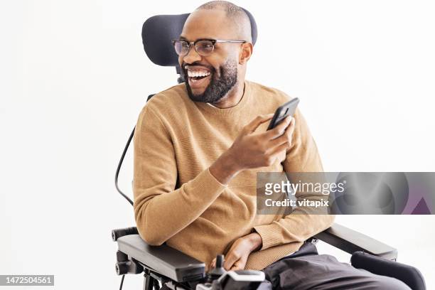 Young Black Man Using Smartphone in Living room