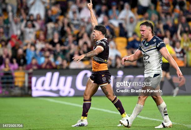 Reece Walsh of the Broncos celebrates scoring a try during the round 2 NRL match between the Brisbane Broncos and the North Queensland Cowboys at...