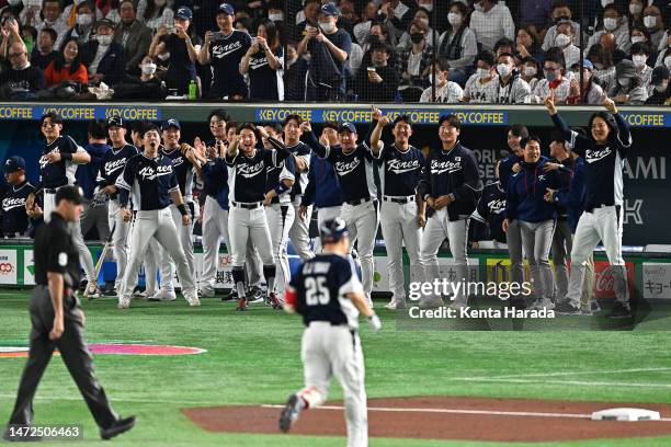 Korea players celebrate Euiji Yang of Korea hitting a two-run home run to make it 2-0 in the third inning during the World Baseball Classic Pool B...