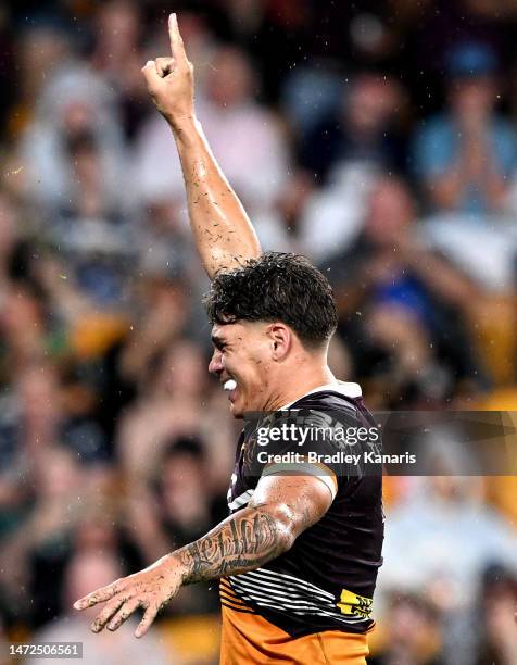 Reece Walsh of the Broncos celebrates scoring a try during the round 2 NRL match between the Brisbane Broncos and the North Queensland Cowboys at...