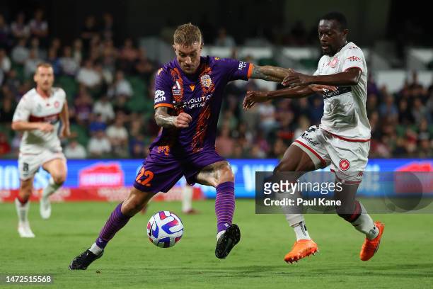 Adam Taggart of the Glory controls the ball against Adama Traore of the Wanderers during the round 20 A-League Men's match between Perth Glory and...