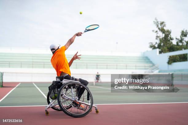 disabled tennis player hits the ball - wheelchair sport stock pictures, royalty-free photos & images