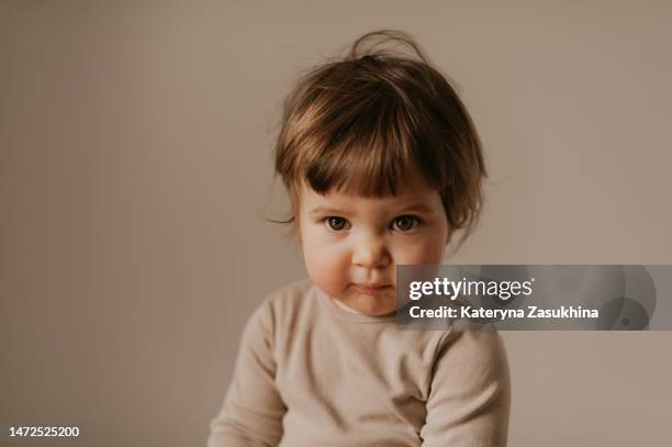 a closeup portrait of a beautiful baby - baby girls stock pictures, royalty-free photos & images