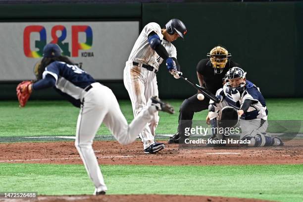 Shohei Ohtani of Japan hits a RBI single to make it 4-8 in the sixth inning during the World Baseball Classic Pool B game between Korea and Japan at...