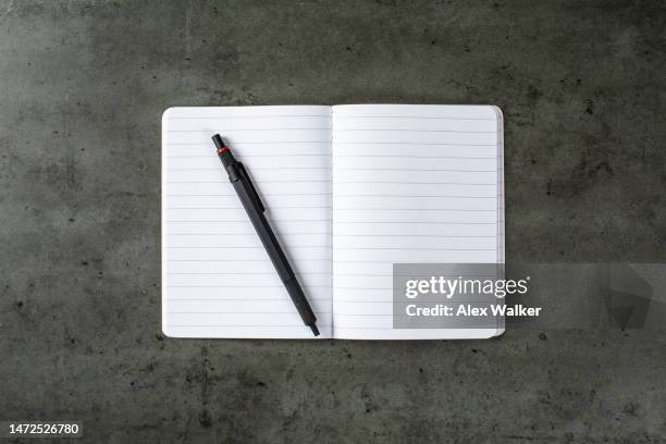 ballpoint pen on open notebook with lined paper - agenda template stock pictures, royalty-free photos & images