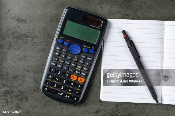 ballpoint pen on open notebook with calculator - agenda template stock pictures, royalty-free photos & images