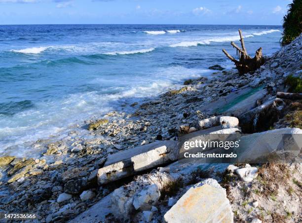 tuvalu - collapsed sea wall, climate change and rising sea level - funafuti atoll - tuvalu stock pictures, royalty-free photos & images