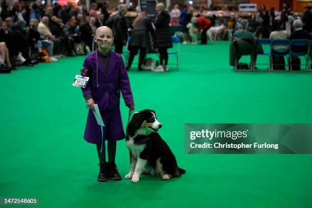 Cancer sufferer Freya Harris, aged eight, and her Australian Shepherd Echo, from Lincolnshire, compete in the show ring on the second day of Crufts...