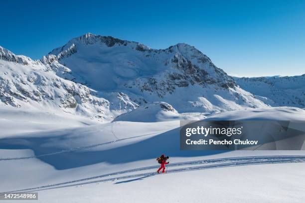 mountaineer climbing along snow ridge pirin mountain panorama - winter sport walk old stock pictures, royalty-free photos & images