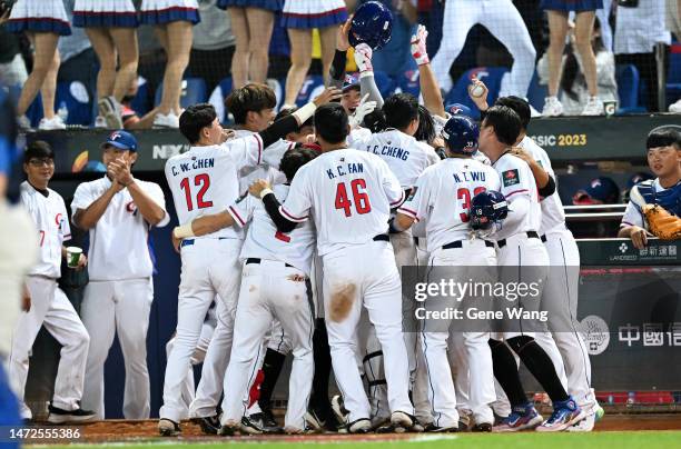 Team Chinese Taipei react after Kungkuan Giljegilaw of Chinese Taipei hits a three run homerun at the bottom of the 8th inning during the World...