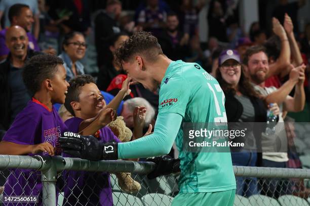 Cameron Cook of the Glory celebrates a goal by Aaron McEneff with some young supporters during the round 20 A-League Men's match between Perth Glory...