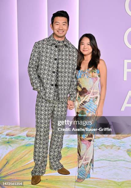 Simu Liu and Allison Hsu attend the 2023 Green Carpet Fashion Awards at NeueHouse Hollywood on March 09, 2023 in Hollywood, California.