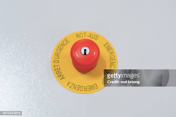 stop button and the hand of worker about to press it. emergency stop button. big red emergency button or stop button for manual pressing. - big red button stock pictures, royalty-free photos & images