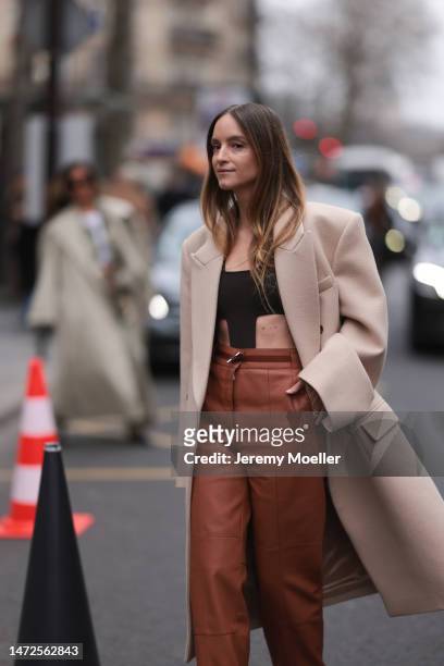 Charlotte Groeneveld seen wearing brown Hermes leather pants, brown top, beige long coat, outside Hermes Show, during Pariser Fashion Week on March...