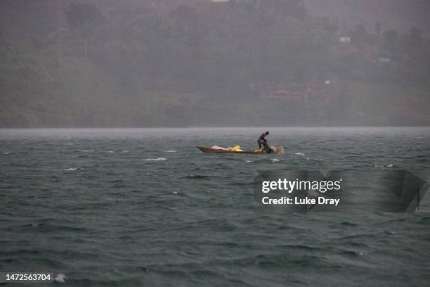 Fishermen works during heavy rain on Lake Kivu on March 09, 2023 in Kibuye, Rwanda. The KivuWatt power plant, built through international cooperation...