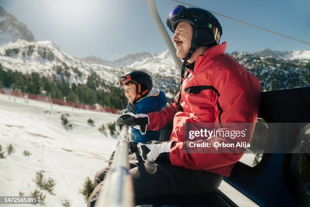 father and son skiing - andorra winter stock pictures, royalty-free photos & images