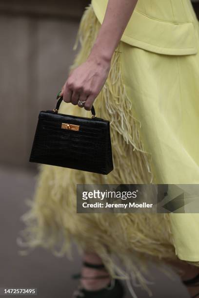 Sira Pevida seen wearing a long yellow dress, black mini Kelly Hermes handbag, green high heels , outside Hermes Show, during Pariser Fashion Week on...