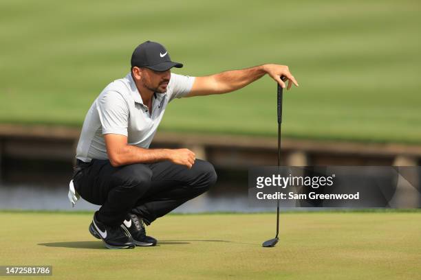 Jason Day of Australia lines up a putt on the fourth green during the second round of THE PLAYERS Championship on THE PLAYERS Stadium Course at TPC...