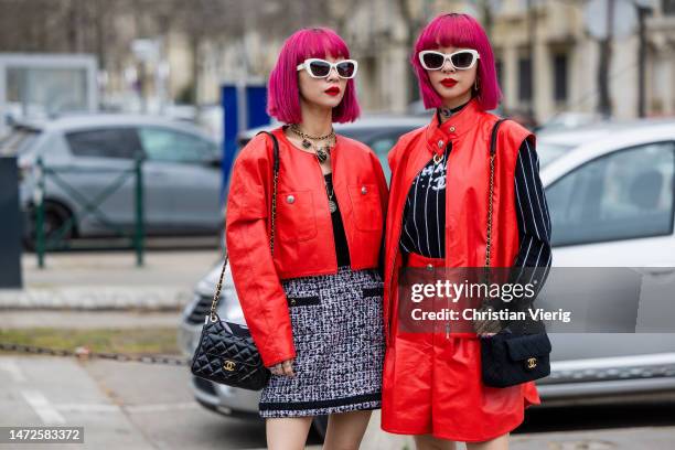 Twins Ami Amiaya & Aya Amiaya wears red cropped jacket, black white skirt, wide leg shorts, sleeveless jacket, black white striped jumper with logo...