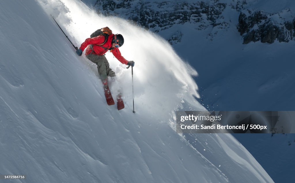 Man skiing on snowcapped mountain,Dvor,Bovec,Slovenia