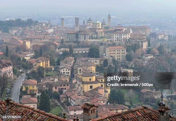 high angle view of buildings in city,bergamo,italy - church tower restoration appeal stock pictures, royalty-free photos & images