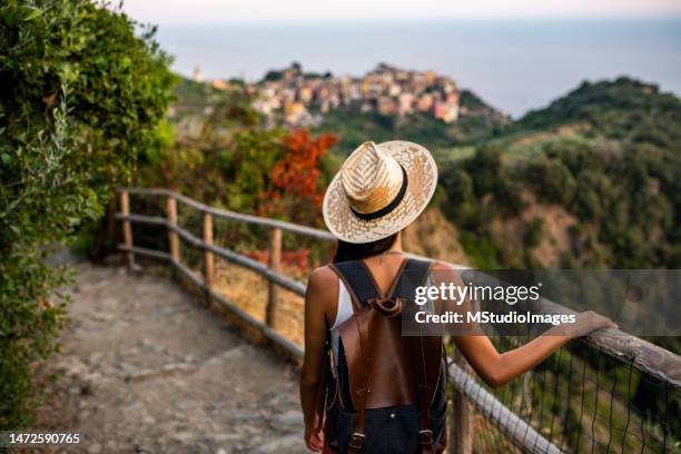 enjoying the view over cinque terre, italy - riomaggiore stock pictures, royalty-free photos & images