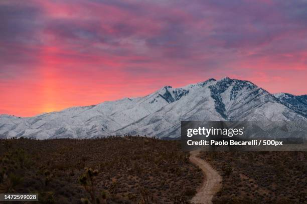 scenic view of snowcapped mountains against sky during sunset,mount charleston,nevada,united states,usa - nevada winter stock pictures, royalty-free photos & images