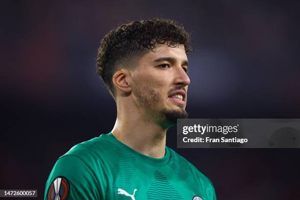 Altay Bayindir of Fenerbahce looks on during the UEFA Europa League round of 16 leg one match between Sevilla FC and Fenerbahce at Estadio Ramon...