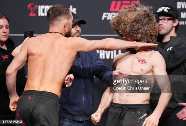 Opponents Petr Yan of Russia and Merab Dvalishvili of Georgia face off during the UFC Fight Night weigh-in at UFC APEX on March 10, 2023 in Las...