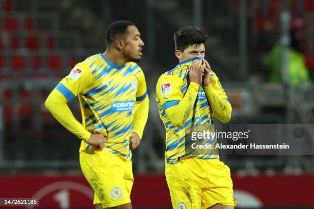 Jannis Nikolaou of Braunschweig reacts with his team mate Immanuel Pherai after the Second Bundesliga match between 1. FC Nürnberg and Eintracht...