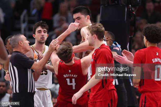 Zach Edey of the Purdue Boilermakers elbows Paul Mulcahy of the Rutgers Scarlet Knights in a scuffle during the second half in the quarterfinals of...