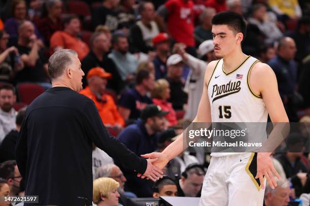 Head coach Matt Painter of the Purdue Boilermakers high fives Zach Edey against the Rutgers Scarlet Knights during the first half in the...