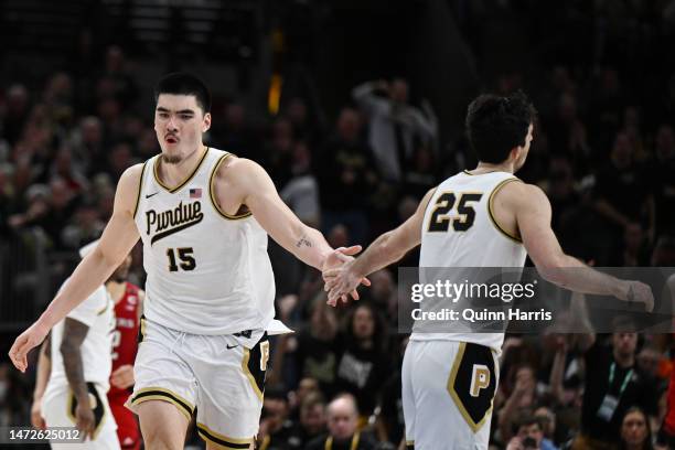 Zach Edey and Ethan Morton of the Purdue Boilermakers celebrate after scoring against the Rutgers Scarlet Knights during the first half in the...