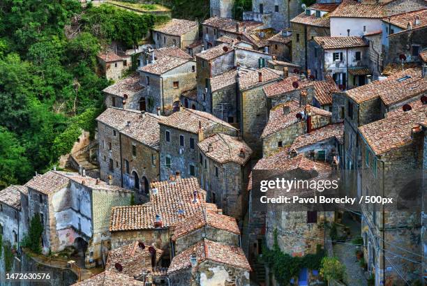 high angle view of buildings in city,sorano,province of grosseto,italy - church tower restoration appeal stock pictures, royalty-free photos & images