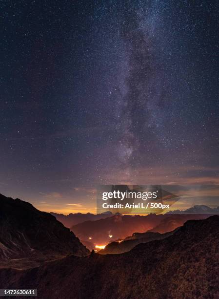 scenic view of mountains against sky at night,passo giau,colle santa lucia,belluno,italy - colle santa lucia stock pictures, royalty-free photos & images