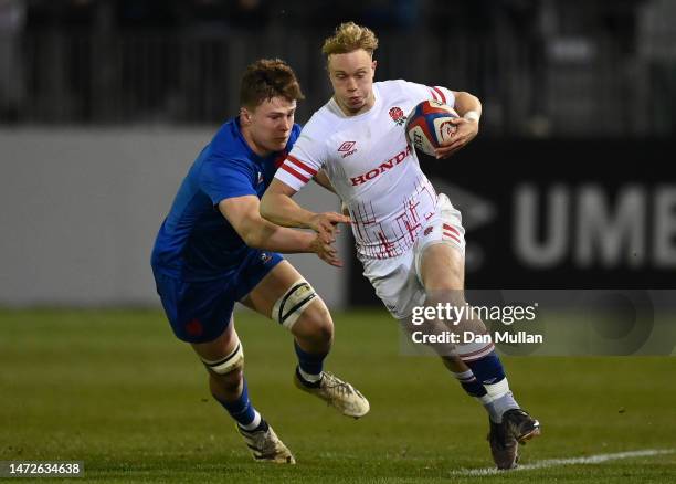 Sam Harris of England is tackled by Marko Gazzotti of France during the U20 Six Nations Rugby match between England and France at Recreation Ground...