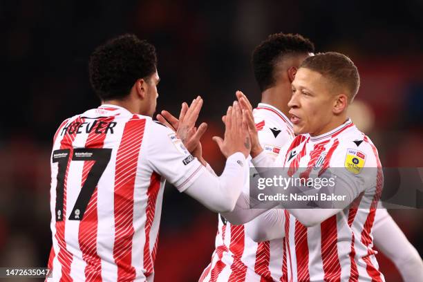 Ki-Jana Hoever of Stoke City celebrates with teammate Dwight Gayle after scoring the team's first goal during the Sky Bet Championship between Stoke...